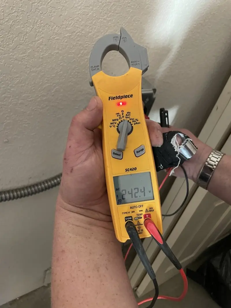 Voltage testing with clamp meter during Outlet Installation in Shakopee